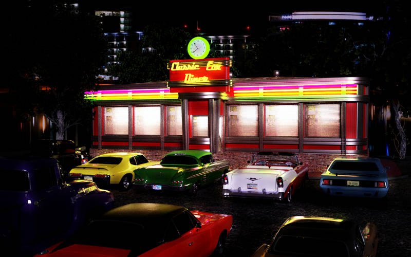 Several muscle cars and classic cars parked in a 1950's style diner parking lot.